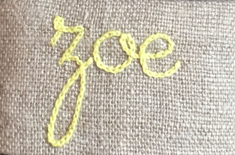 Broderie sur une serviette en tissu